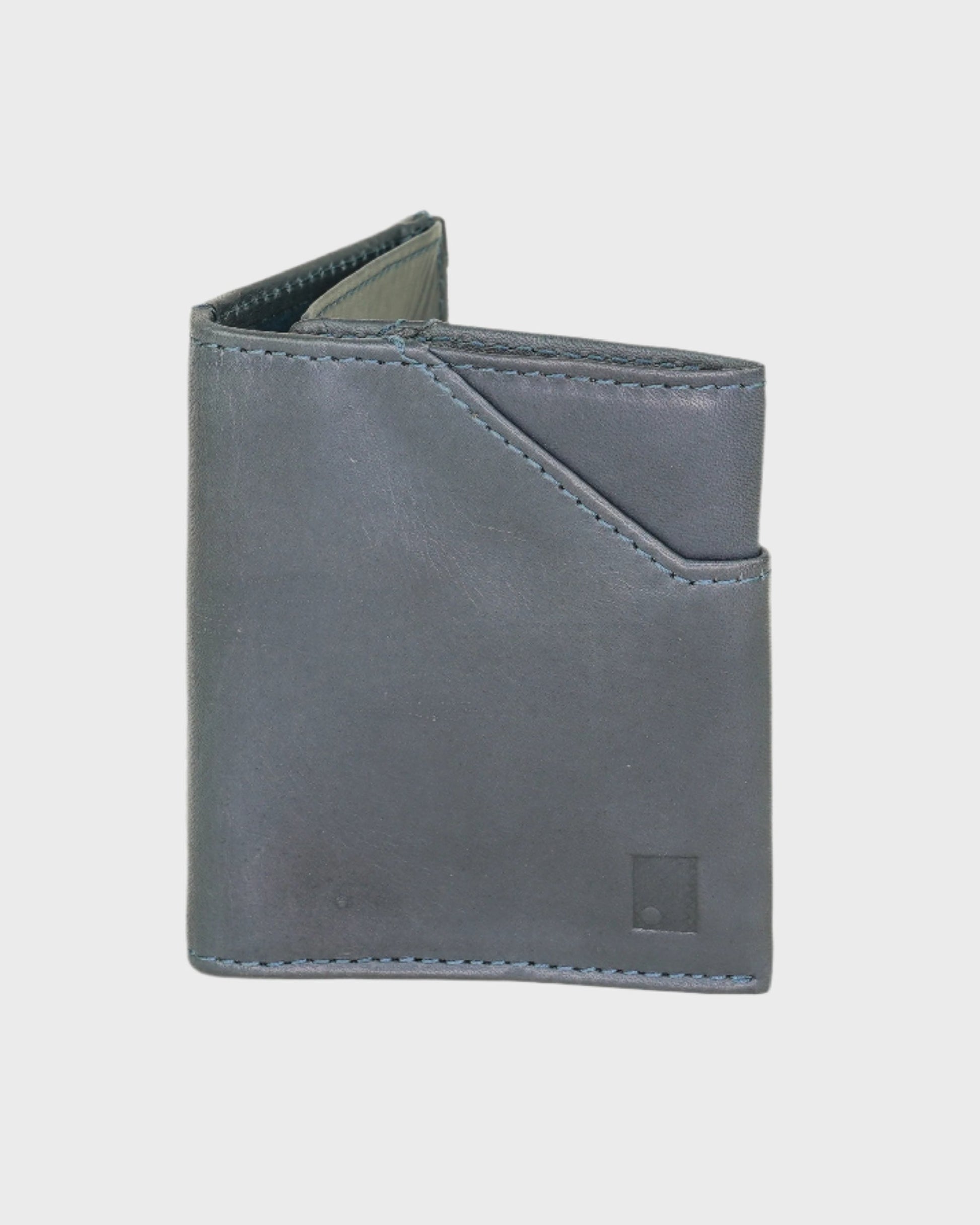 Navy leather wallet on a light gray background
