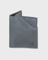 Navy leather wallet on a light gray background