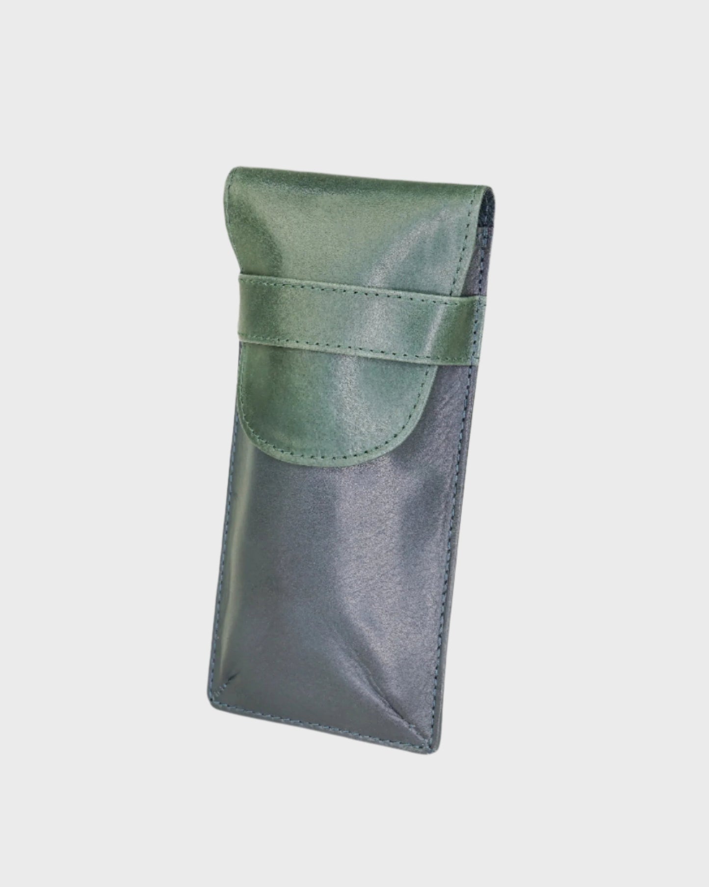 Green and navy leather case on a light gray background