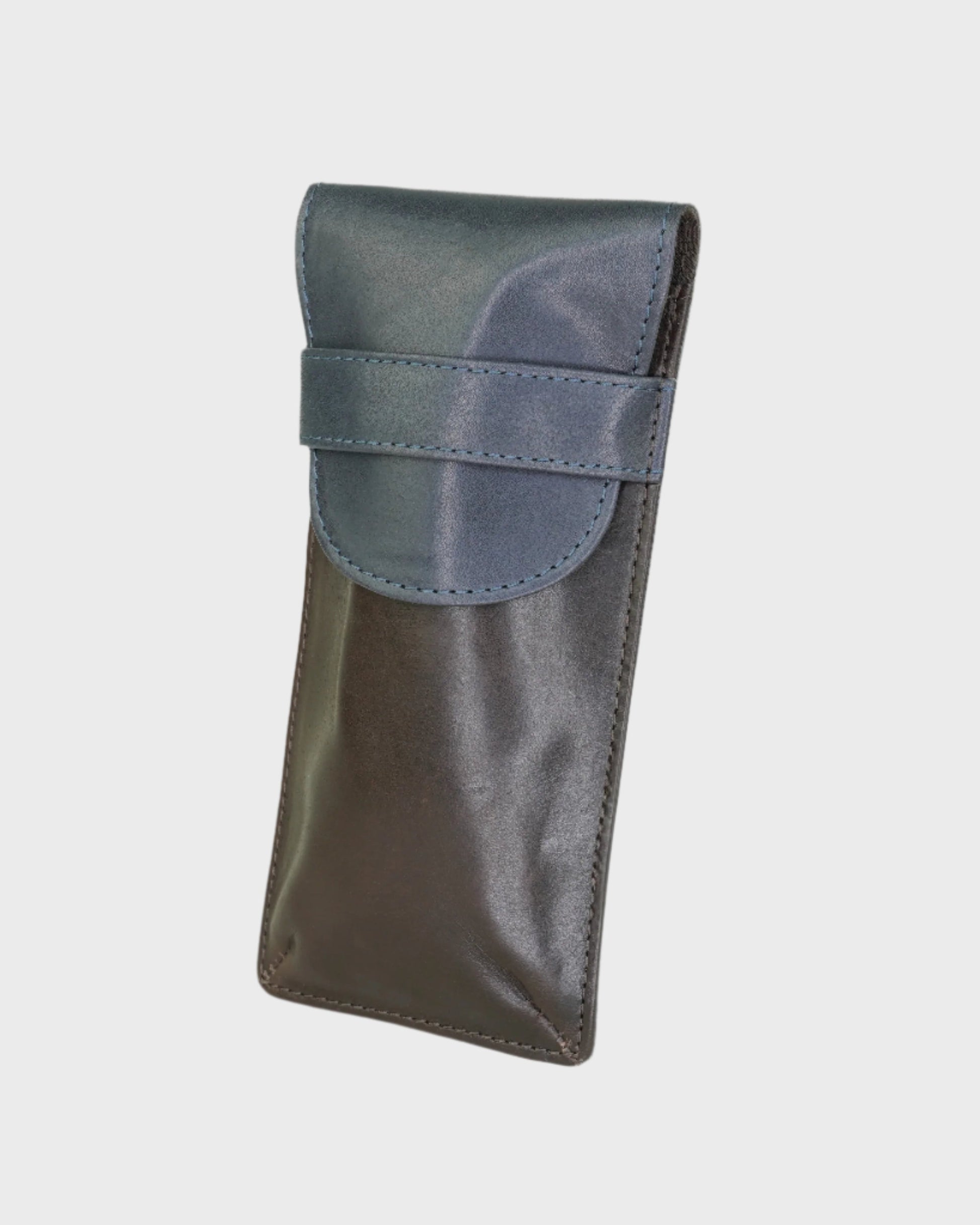 brown and navy leather case on a light gray background