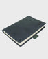 Navy leather notebook on a light gray background