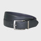 Black leather belt with a silver buckle on a light gray background