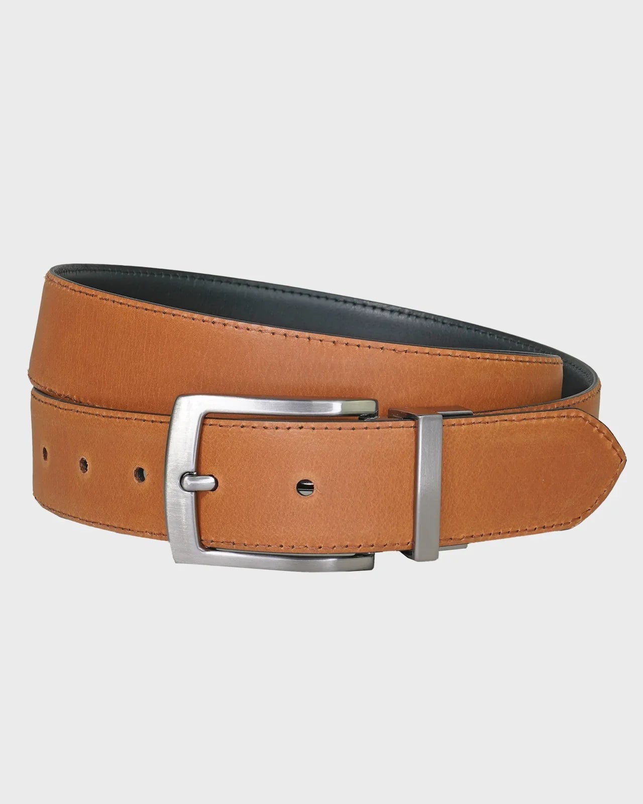 Tan leather belt with silver buckle on a light gray background