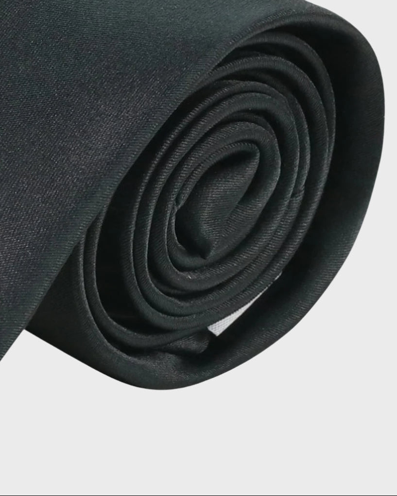 Rolled up Black Sophos tie on a white background