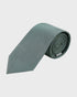 Rolled-up green tie on a light gray background