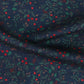 Navy fabric with red and green pattern