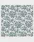 Patterned fabric with green leaves on a white background