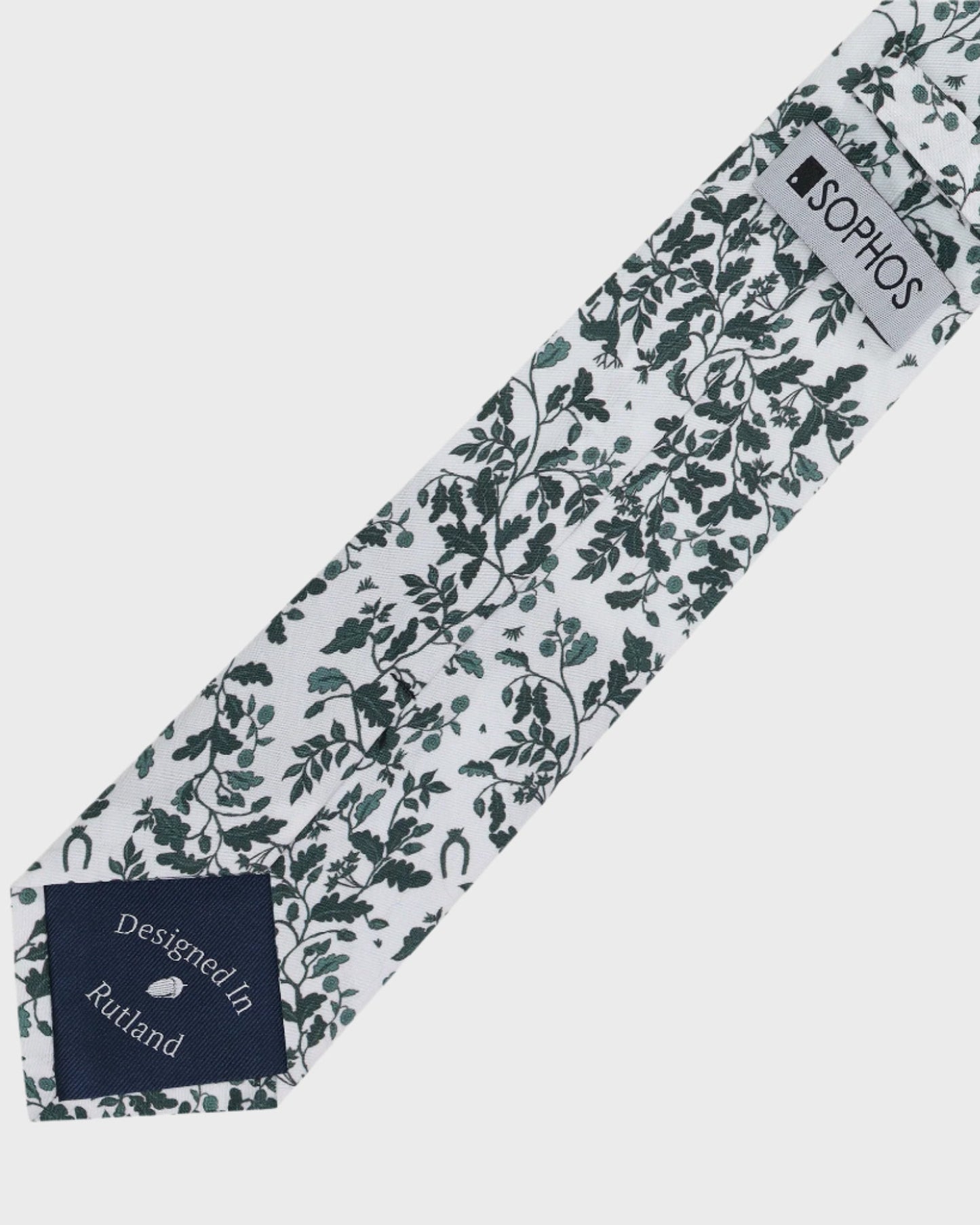 Patterned tie with a brand label on a white background