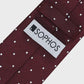 Maroon tie with white polka dots and a visible 'SOPHOS' label on a light gray background