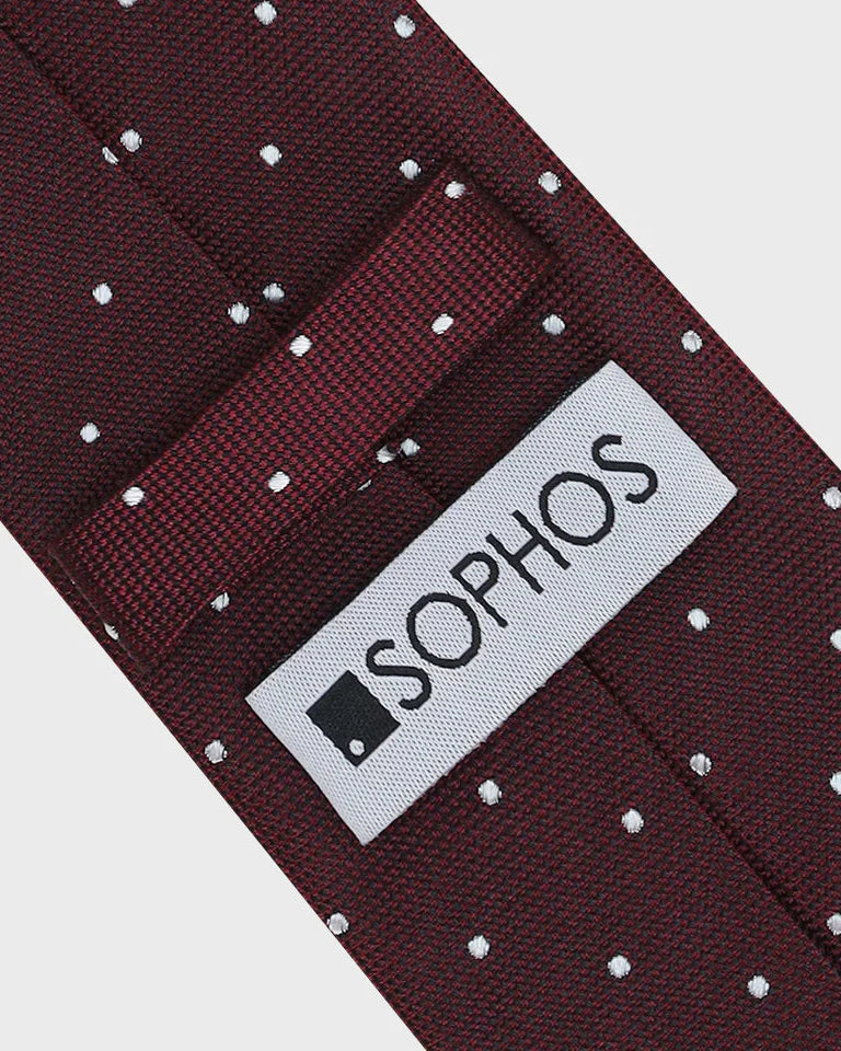 Maroon tie with white polka dots and a Sophos label on a white background