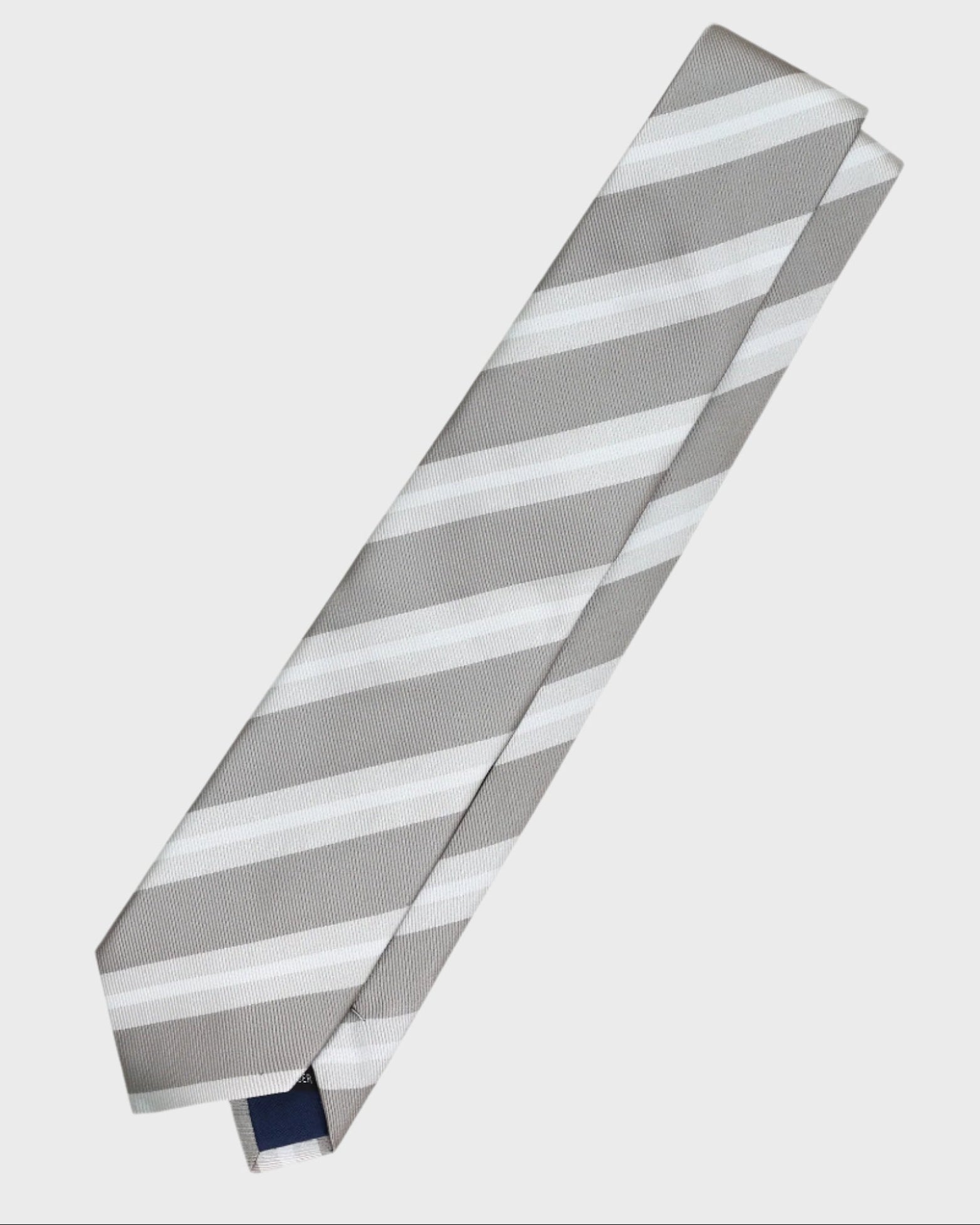 Gray and white striped tie on a light gray background