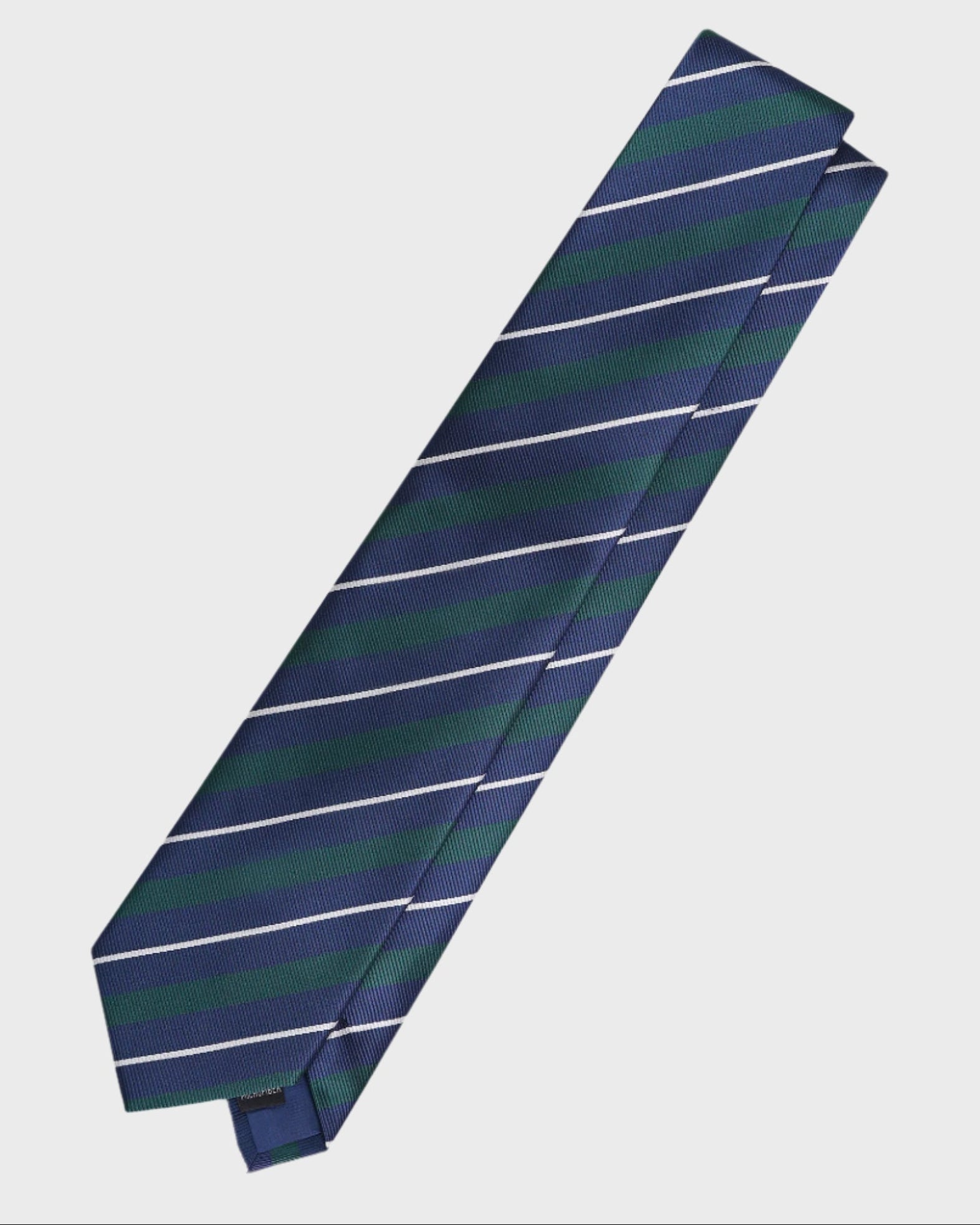 Navy and green striped tie on a light gray background