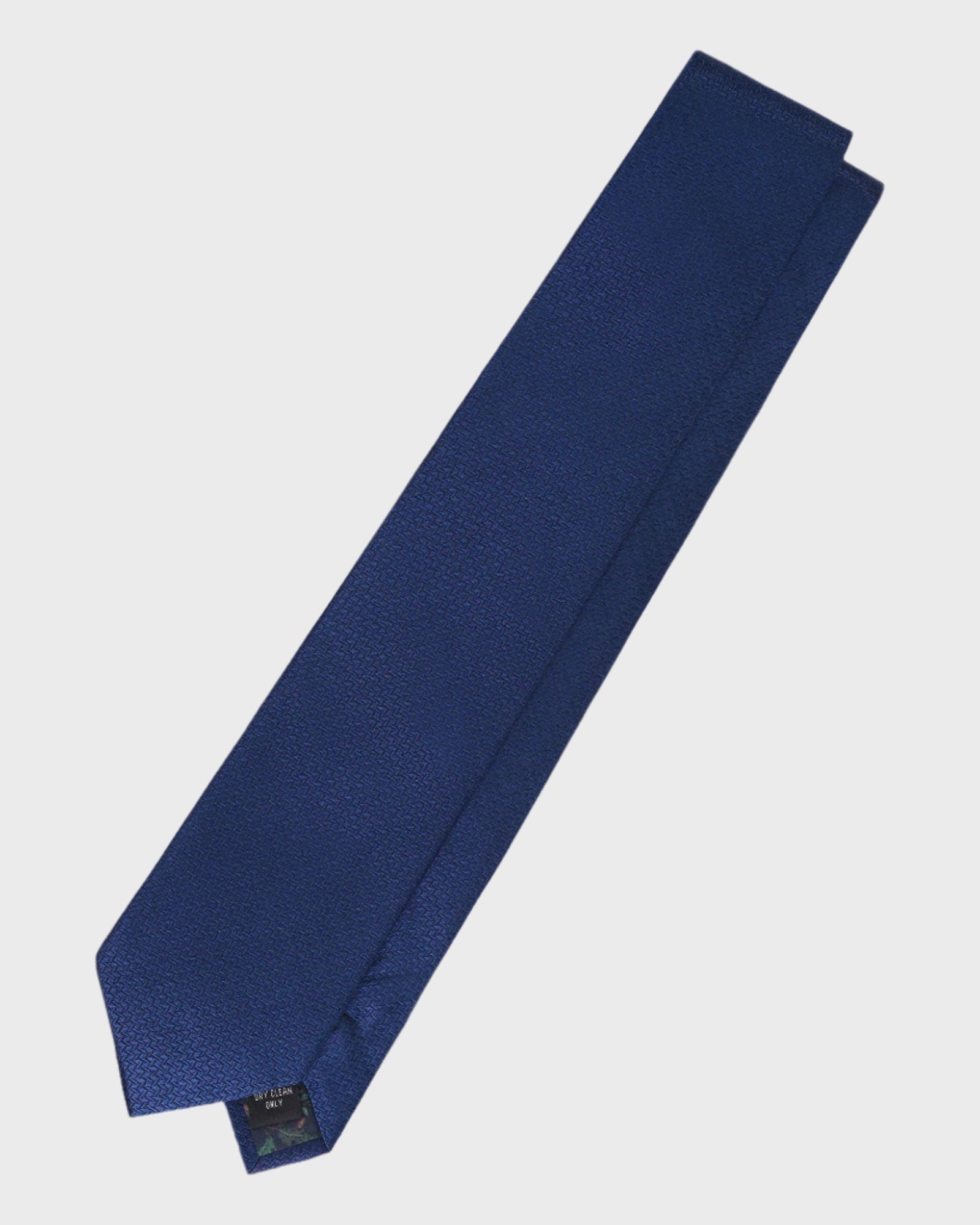 Navy blue tie on a light gray background