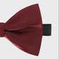 Burgundy bow tie on a light gray background
