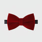 Red velvet bow tie on a light gray background