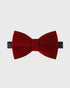 Red velvet bow tie on a light gray background