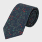 Navy blue tie with red and green leaf pattern on a light gray background