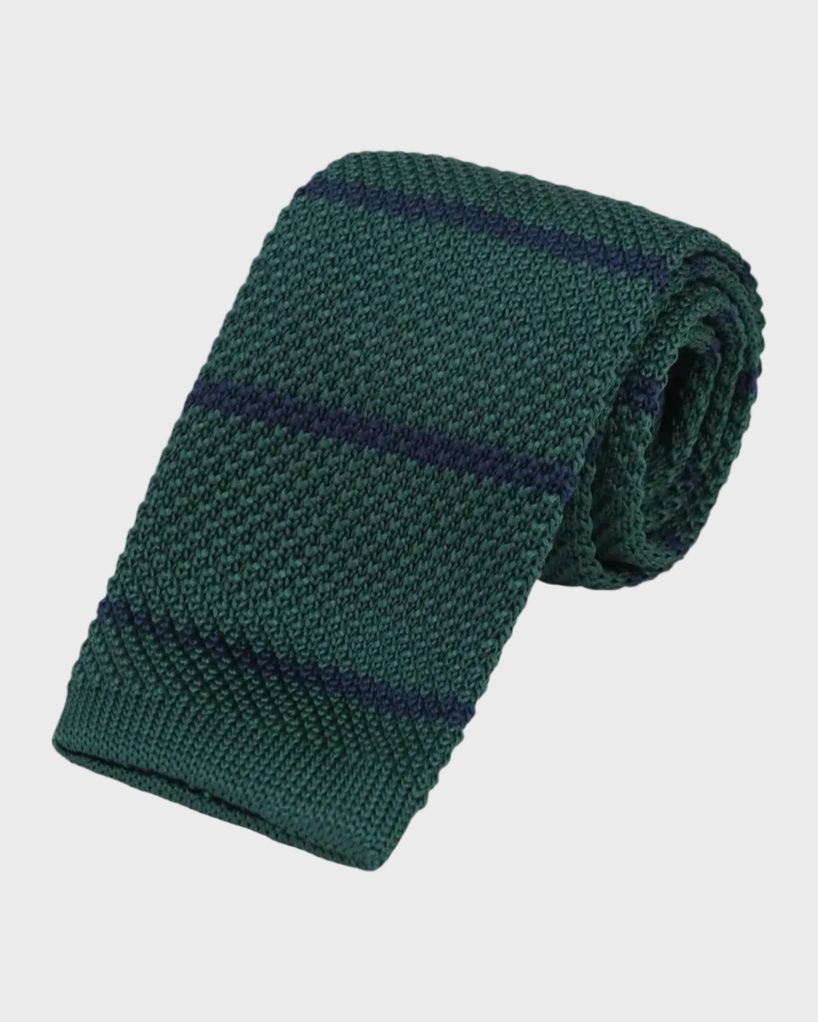 Green knitted tie with navy stripes on a light gray background