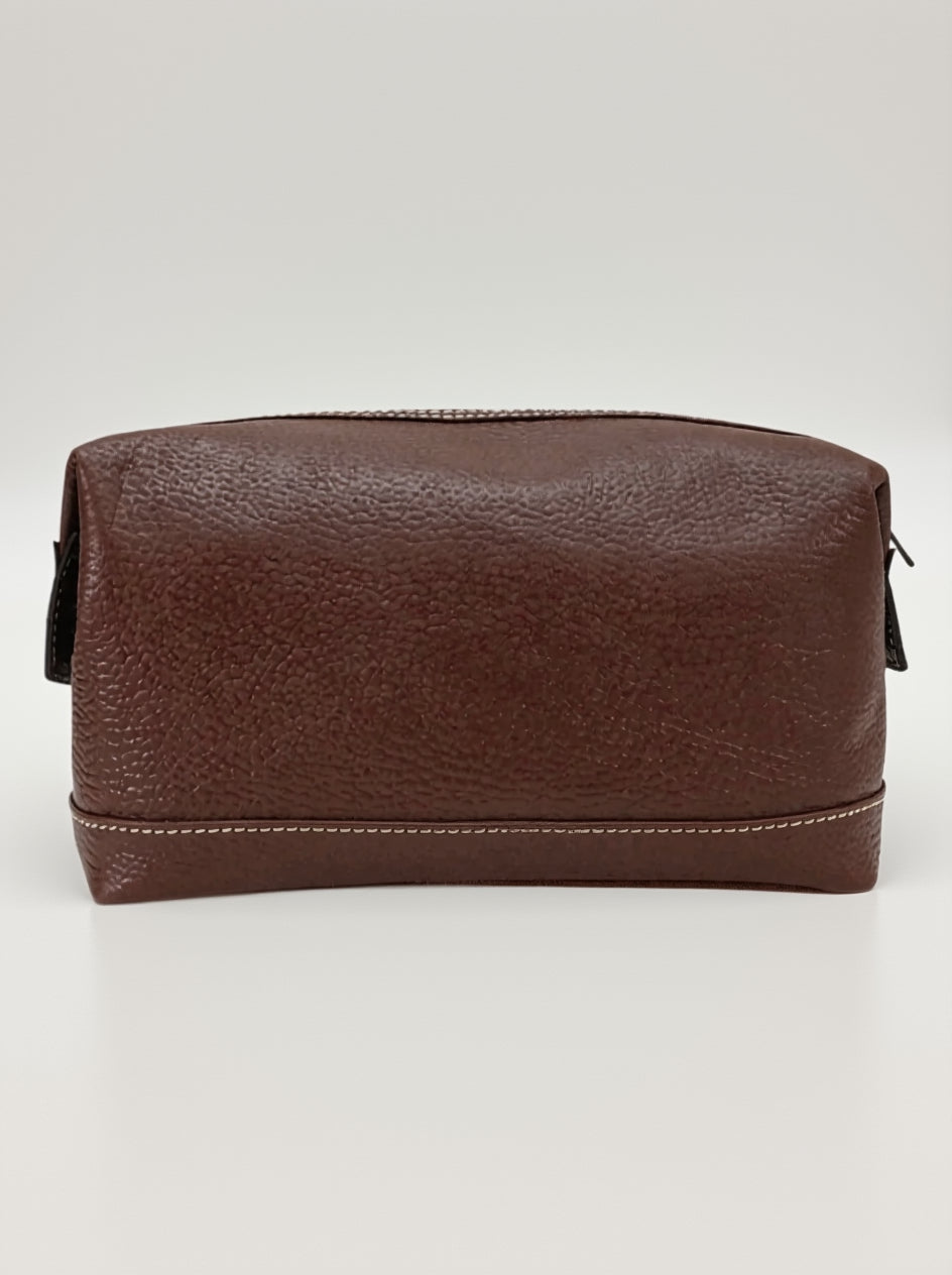 Brown leather toiletry bag on a white background