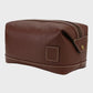 brown leather toiletry bag with a strap on a white background