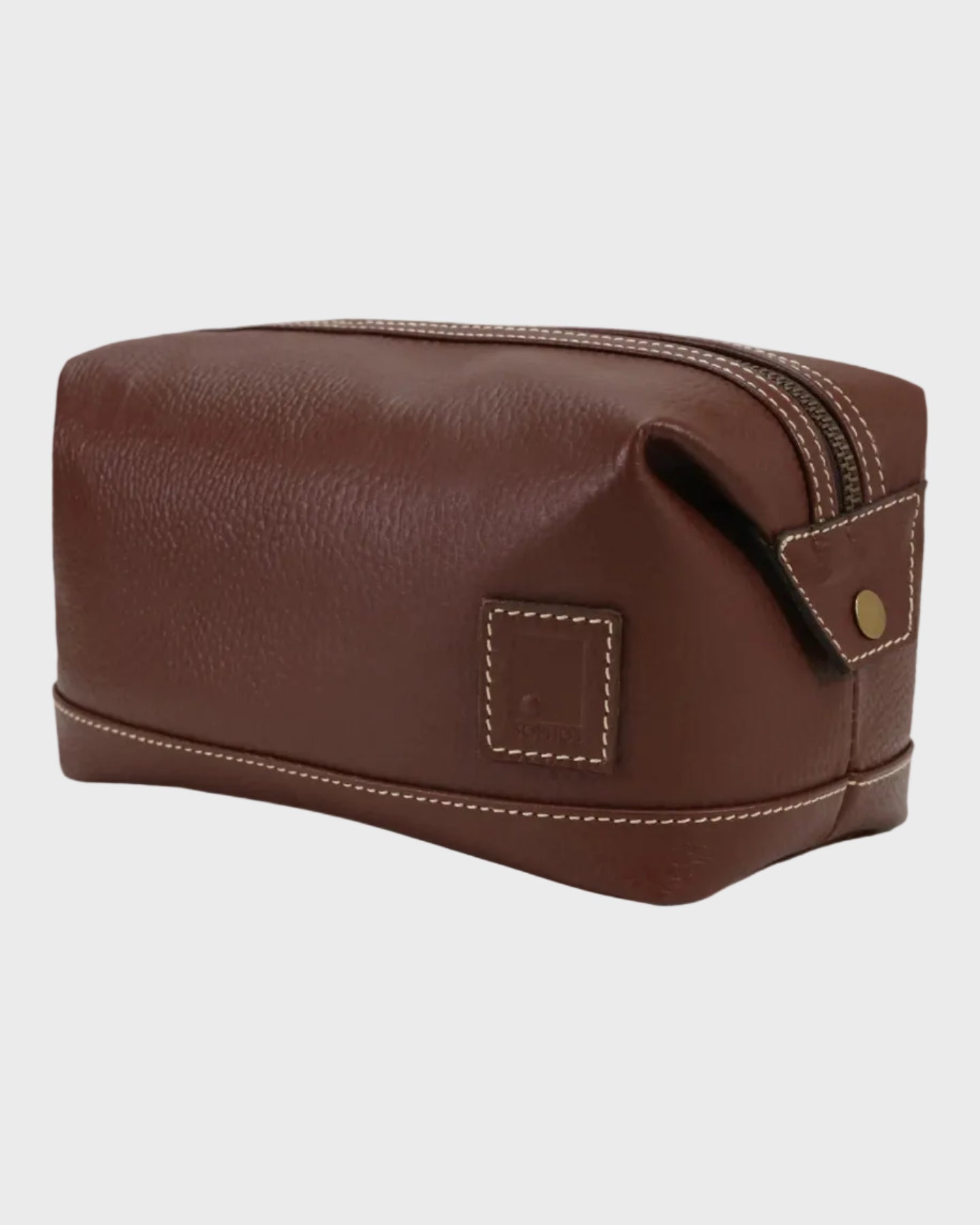 brown leather toiletry bag with a strap on a white background