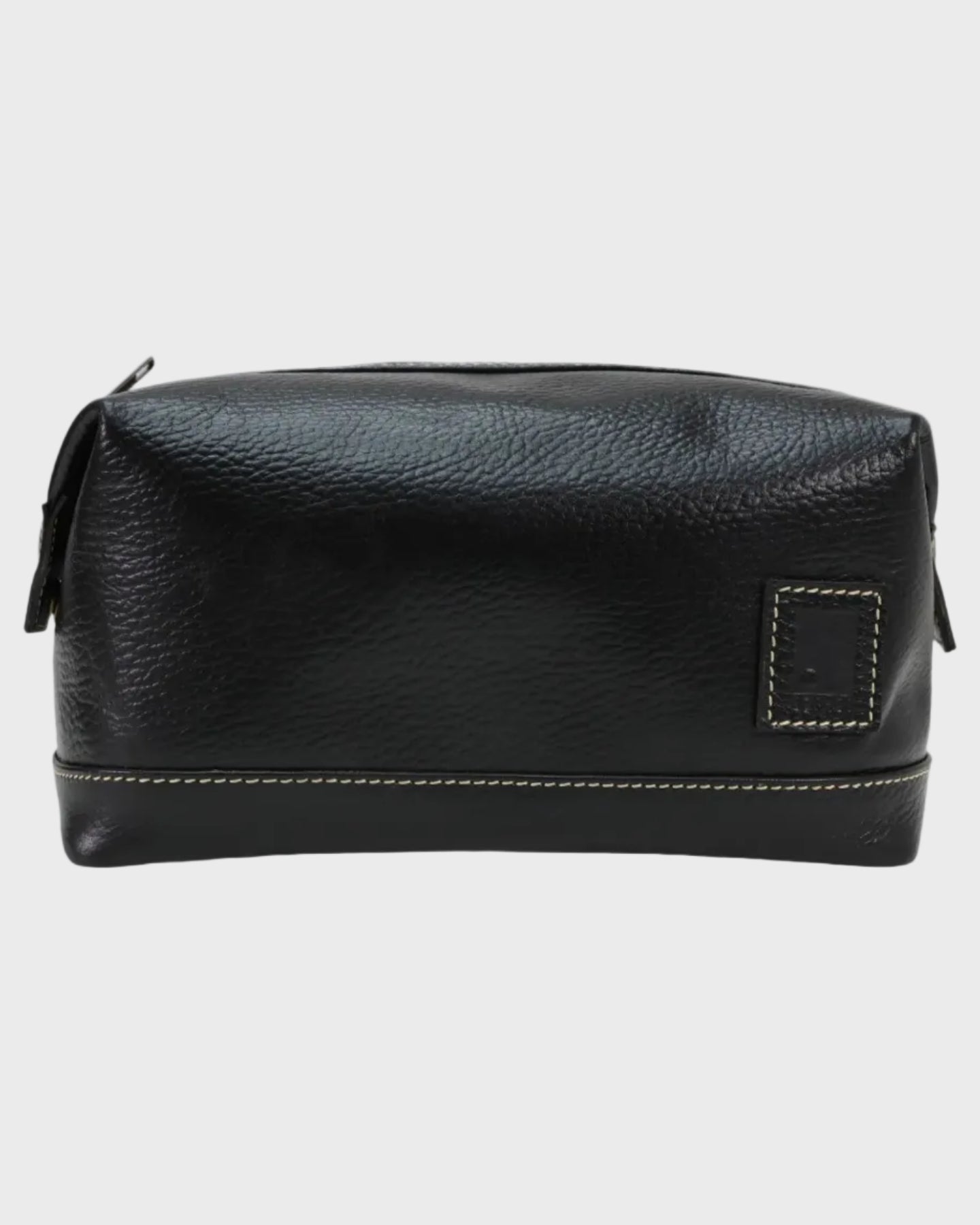 Black leather toiletry bag on a light gray background