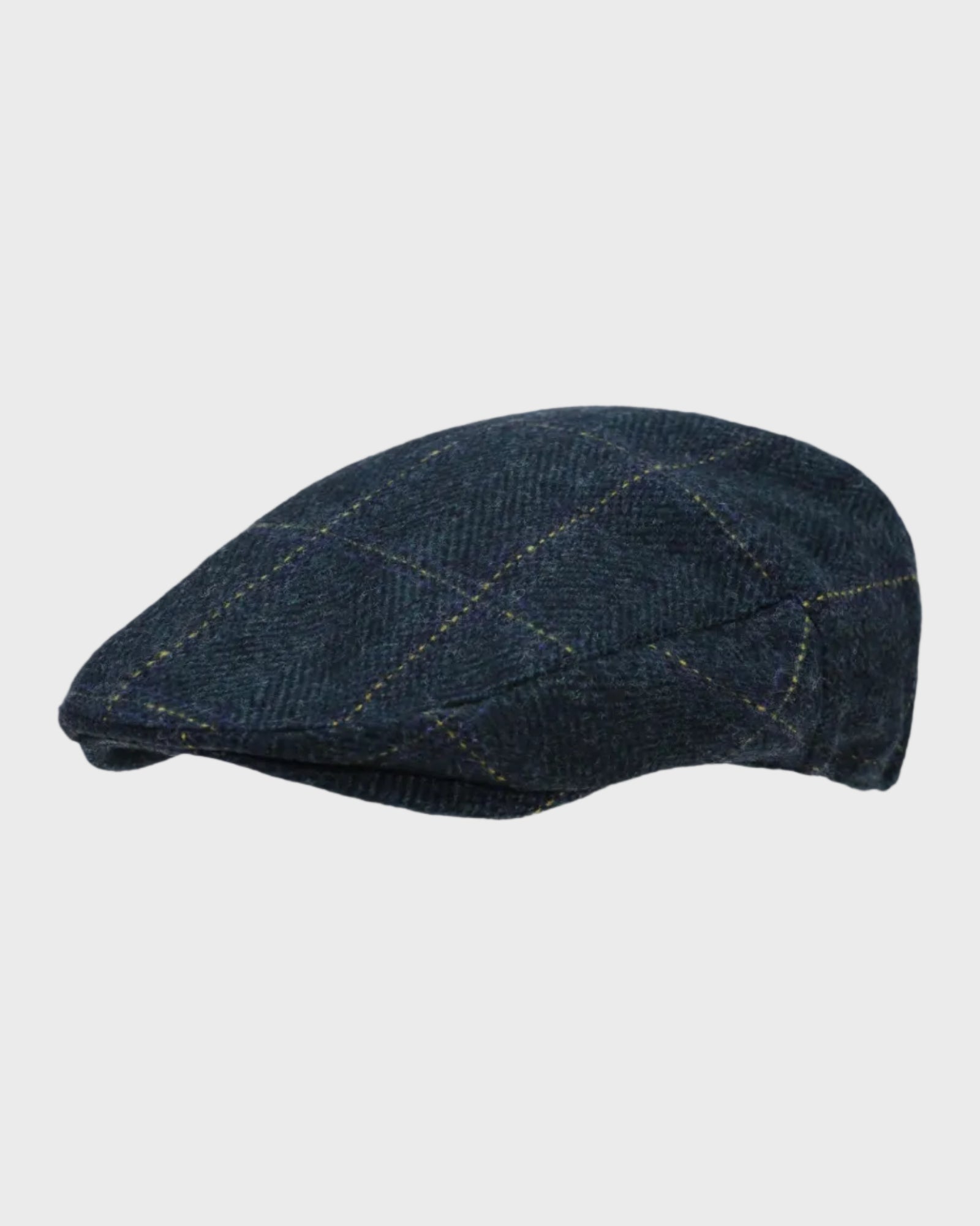 Blue tweed flat cap on a light gray background