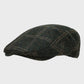 Harris Tweed flat cap on a light gray background