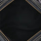 Close-up of a black leather bag with visible stitching details.