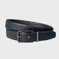 Black leather belt with a silver buckle on a light gray background