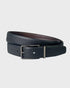 Black leather belt with a silver buckle on a light gray background
