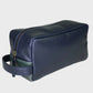 Navy leather toiletry bag on a light gray background