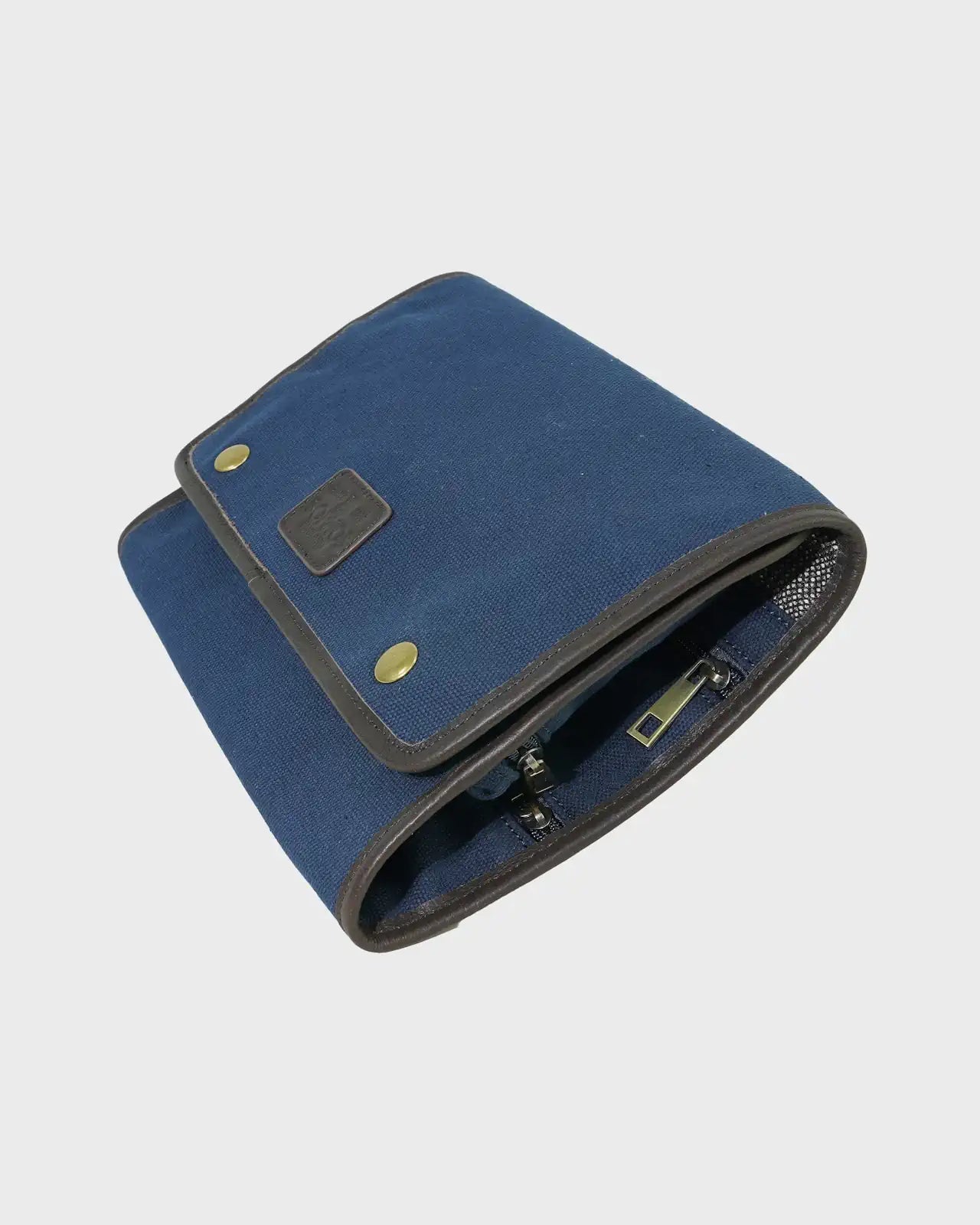 Navy washbag on a light gray background