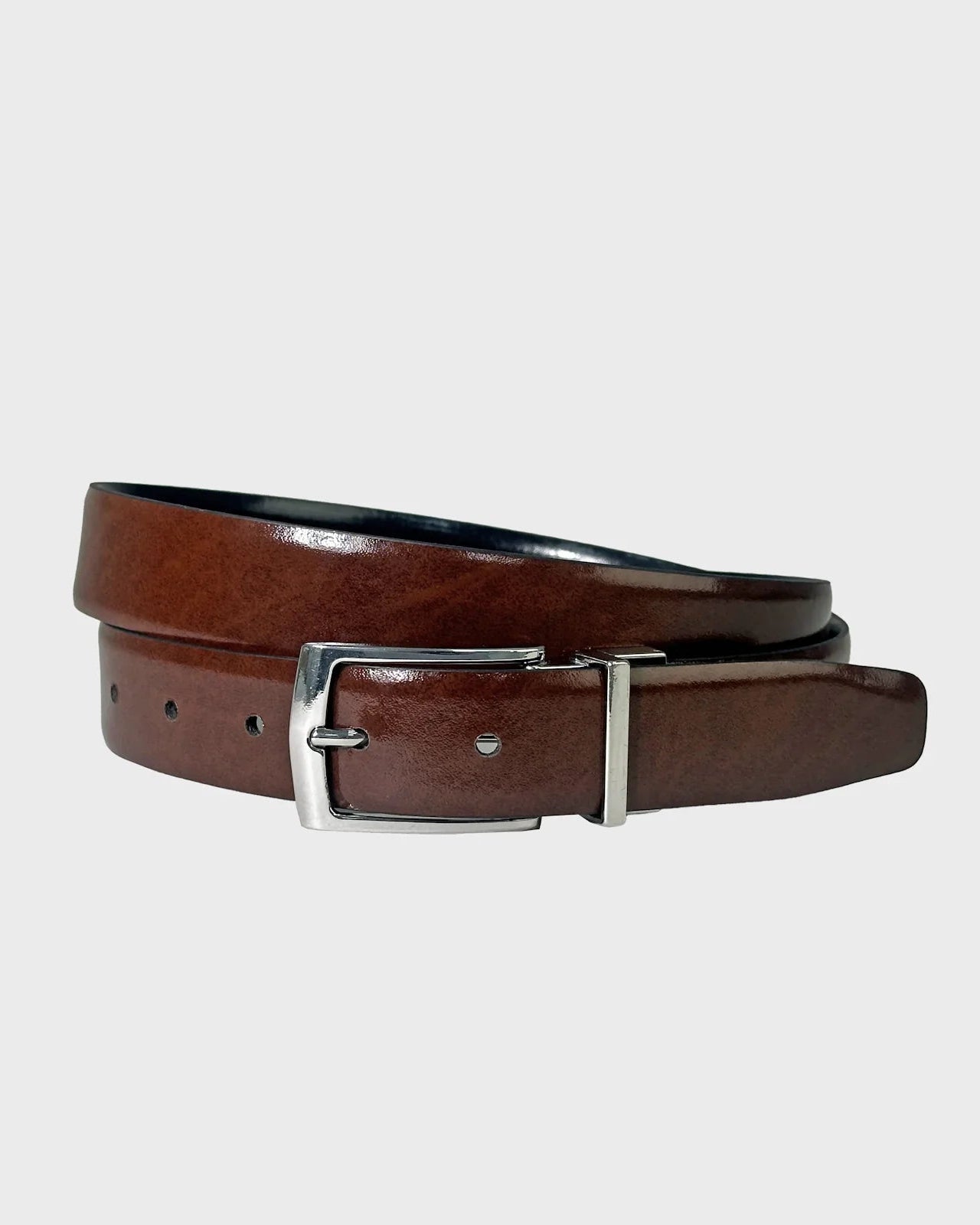 Brown leather belt with silver buckle on a light gray background