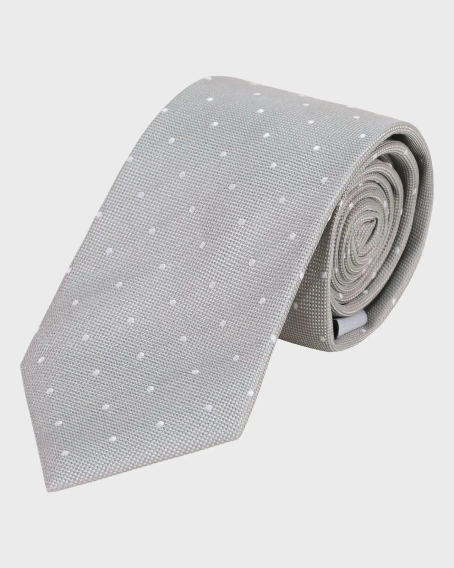 Gray tie with white polka dots on a light gray background